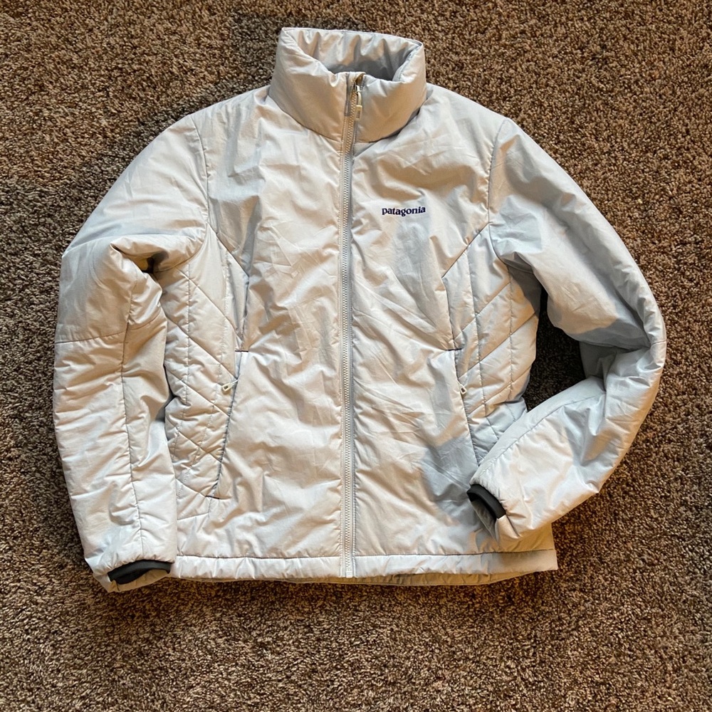 Patagonia light gray jacket with purple accents